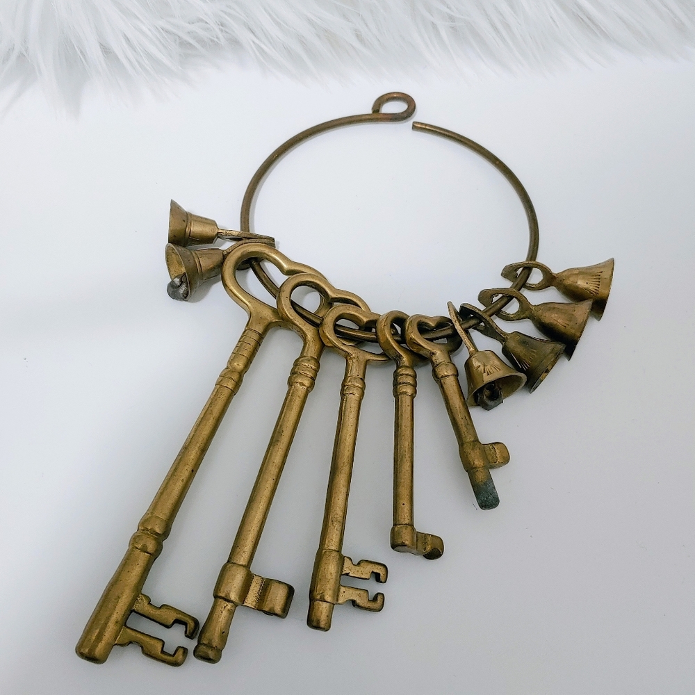 Large heavy brass skeleton keys and bells on ring